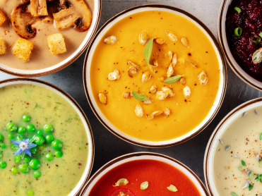 Overhead view of various bowls of soup