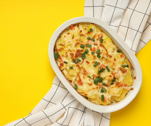 Casserole dish on towel with yellow background