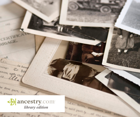Black and white photos and official documents in a pile