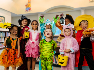 Kids dressed in various halloween costumes