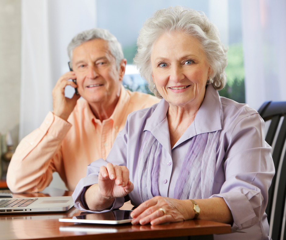 Man and woman seniors sitting at table at home