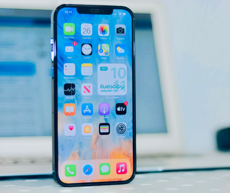 iPhone with Laptop in background